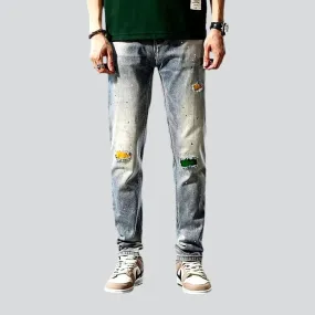 Grunge men's distressed jeans